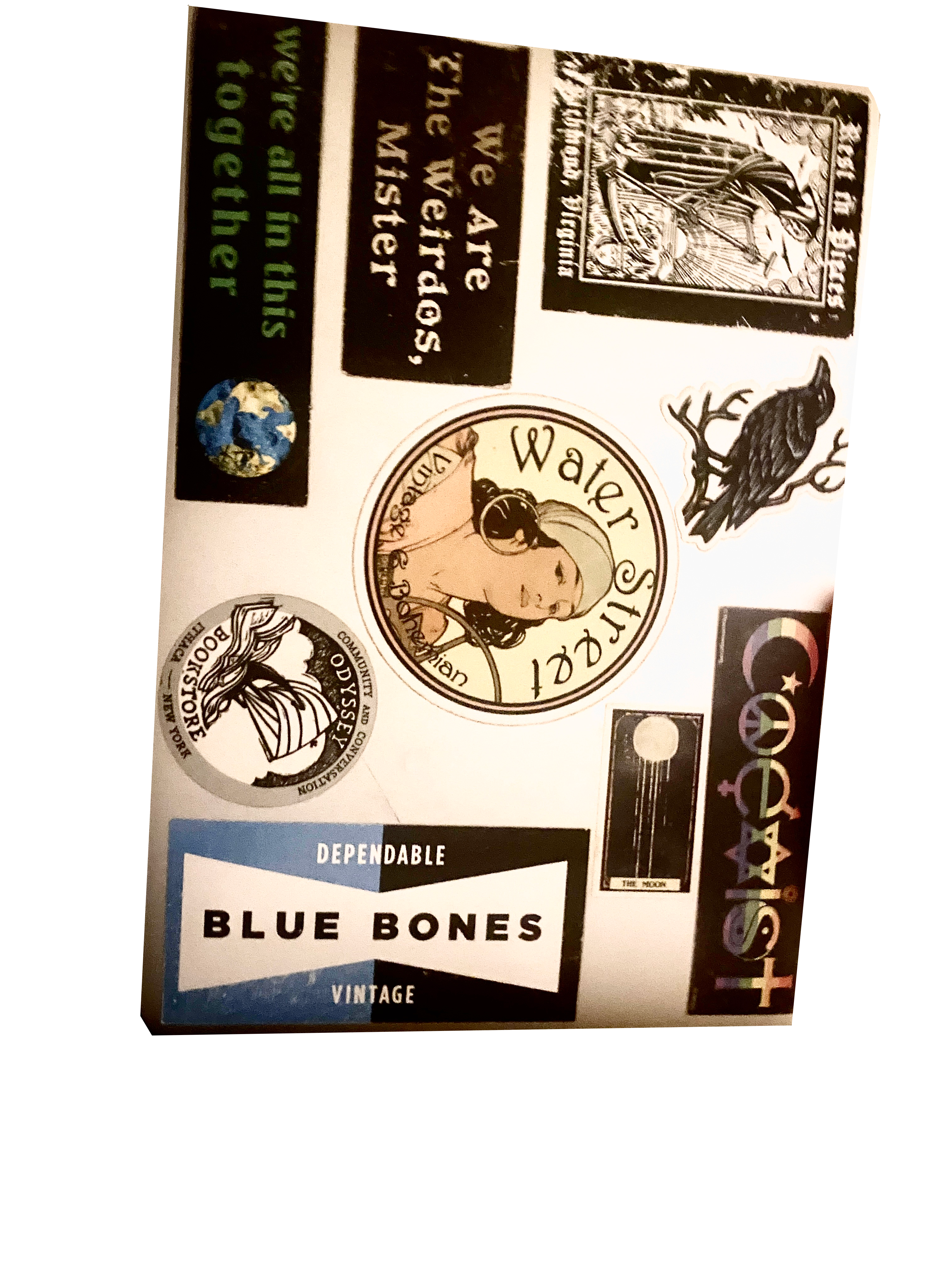 silver laptop with sticker collage