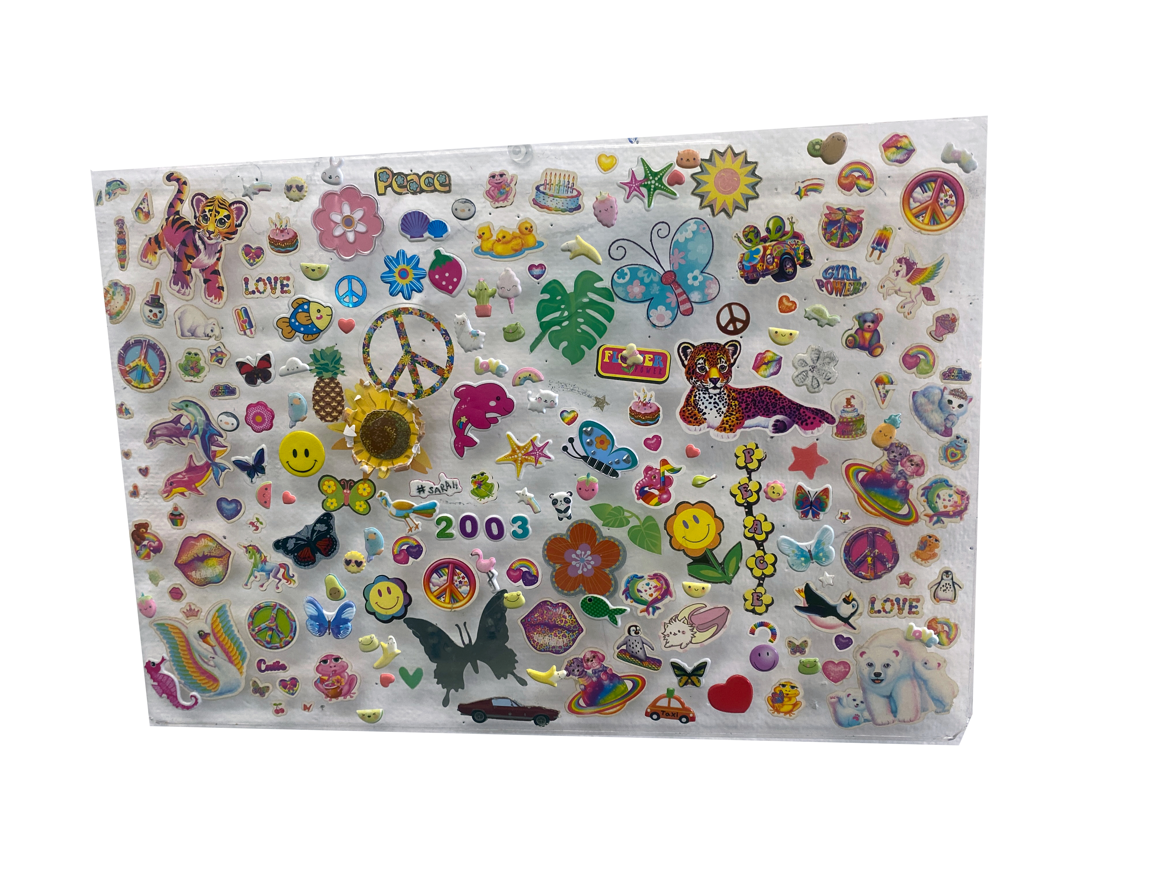 png of random colorful stickers on laptop