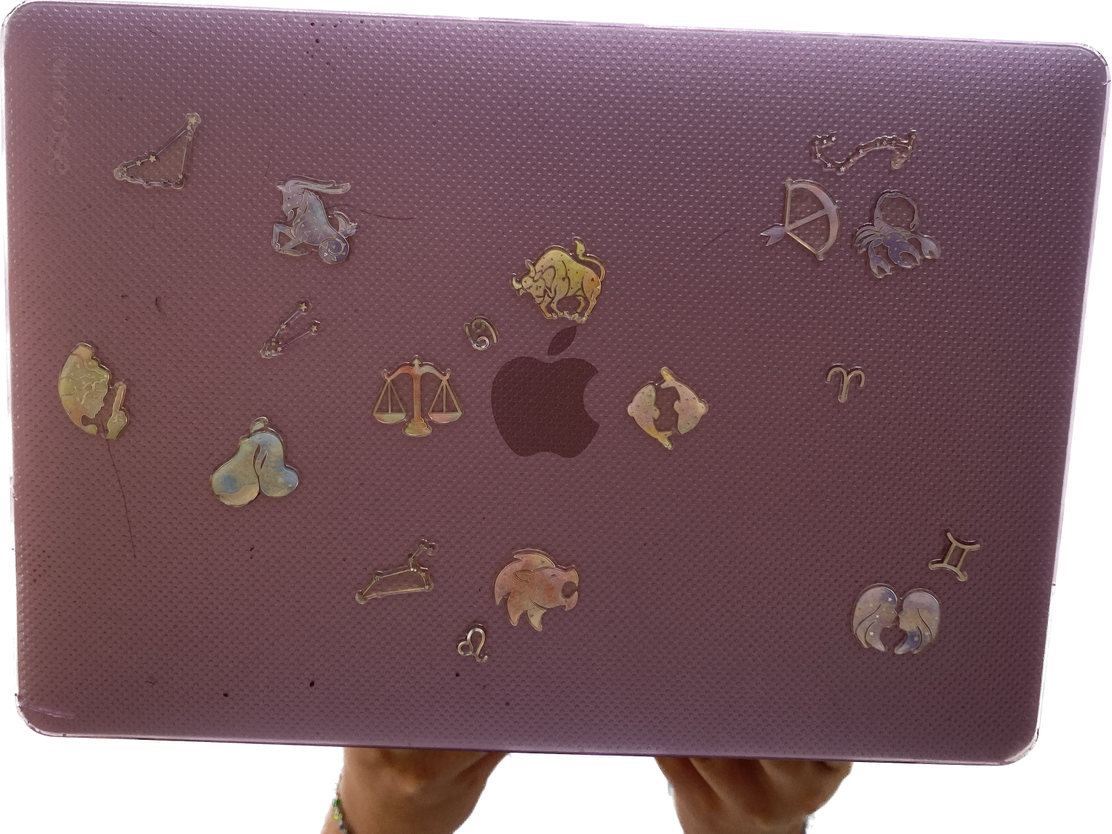 png of a few stickers on purple laptop